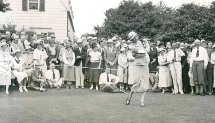 Joyce Wethered, who made a tour of North America in 1935, draws a crowd during an exhibition match on Long Island.